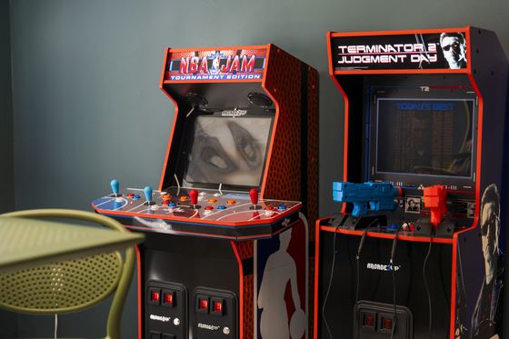 Two upright arcade cabinets side by side.