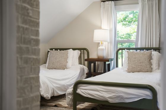 The two single beds beside the upstairs window.